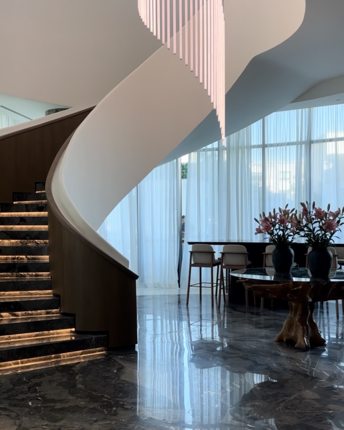 A winding staircase in a luxury hotel